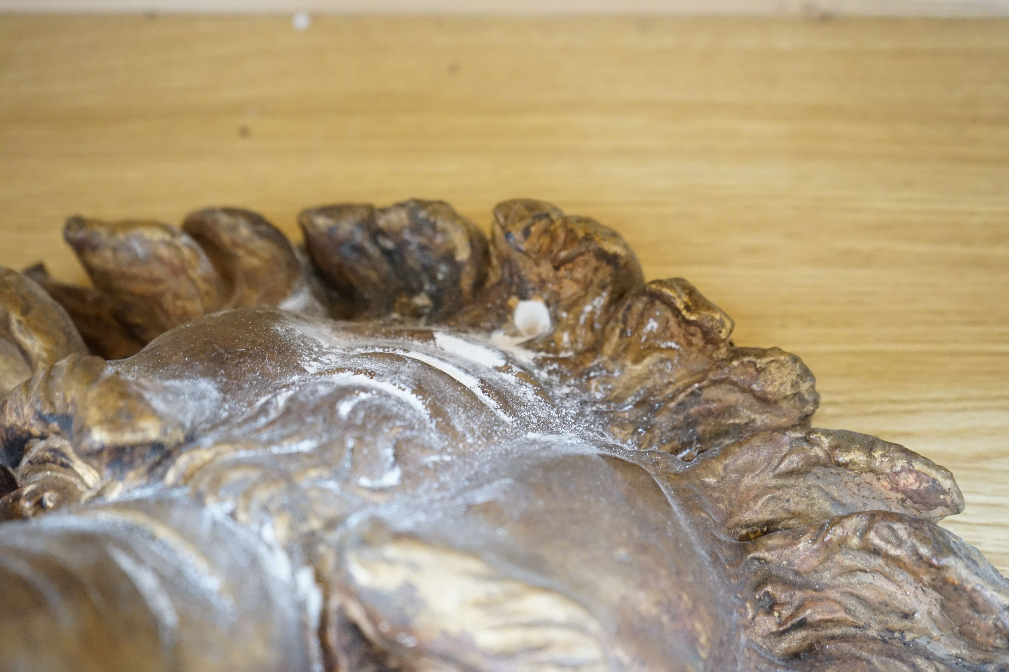 A pair of large decorative gilt plaster lion masks, 42cm